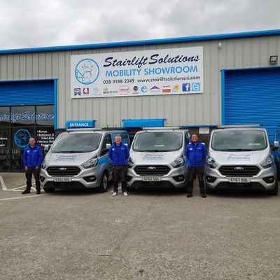 Stairlift Solutions team and vans at the mobility showroom, NI